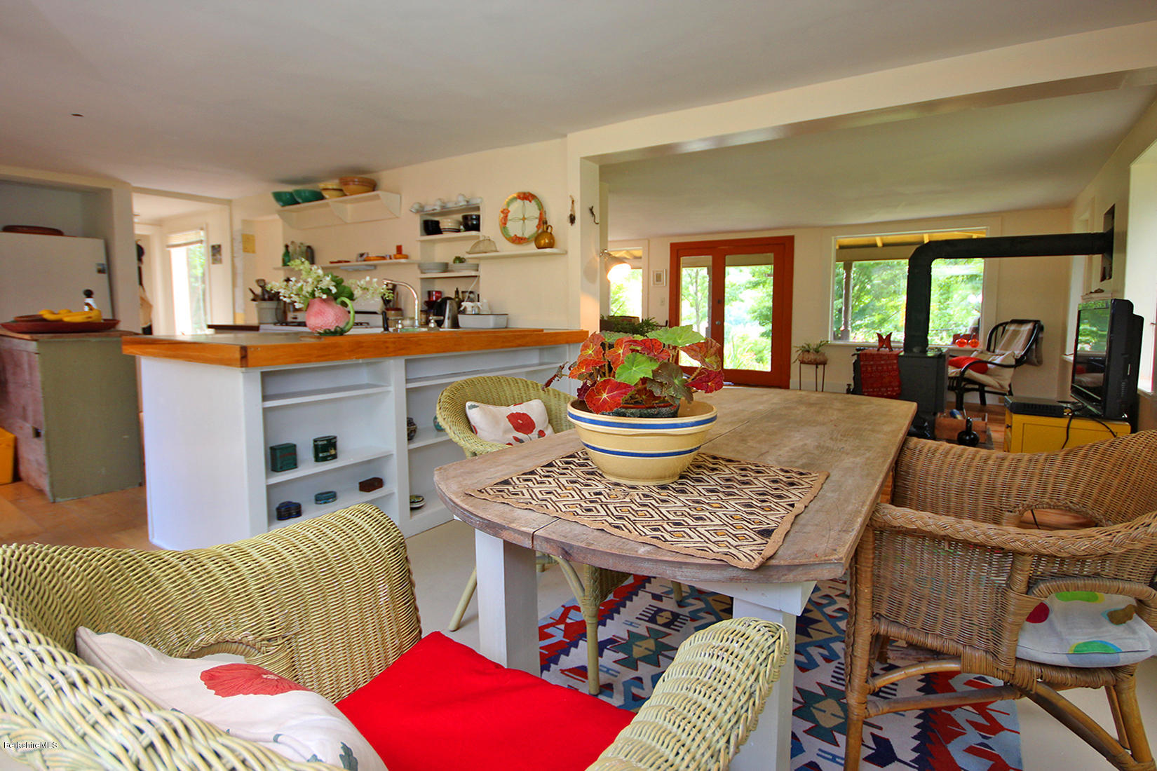 47 Main Road Tyringham, MA 01238 - Photo 9 of 31 a living room with furniture and a large window