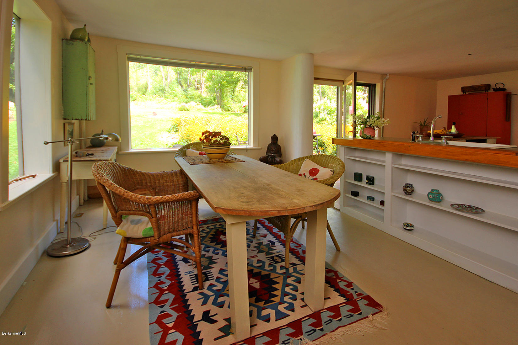 47 Main Road Tyringham, MA 01238 - Photo 10 of 31 a view of a dining room with furniture and a window