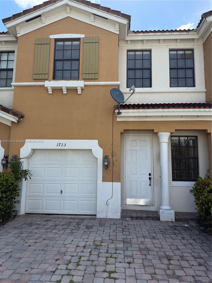 1713 Southwest Umbria Street, Unit 1713 Port St. Lucie, FL 34953 - Photo 1 of 17 a front view of a house