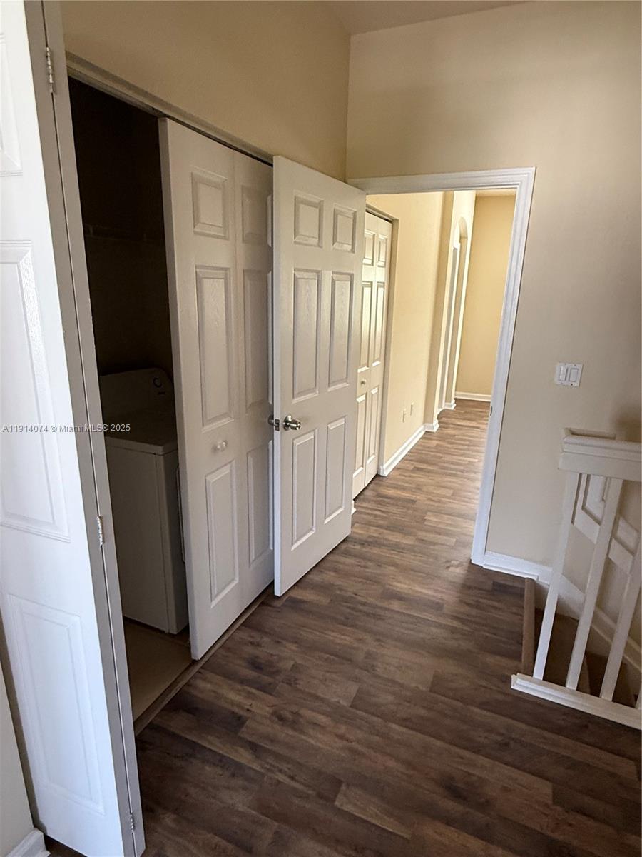 1713 Southwest Umbria Street, Unit 1713 Port St. Lucie, FL 34953 - Photo 13 of 17 a view of a hallway with wooden floor and staircase