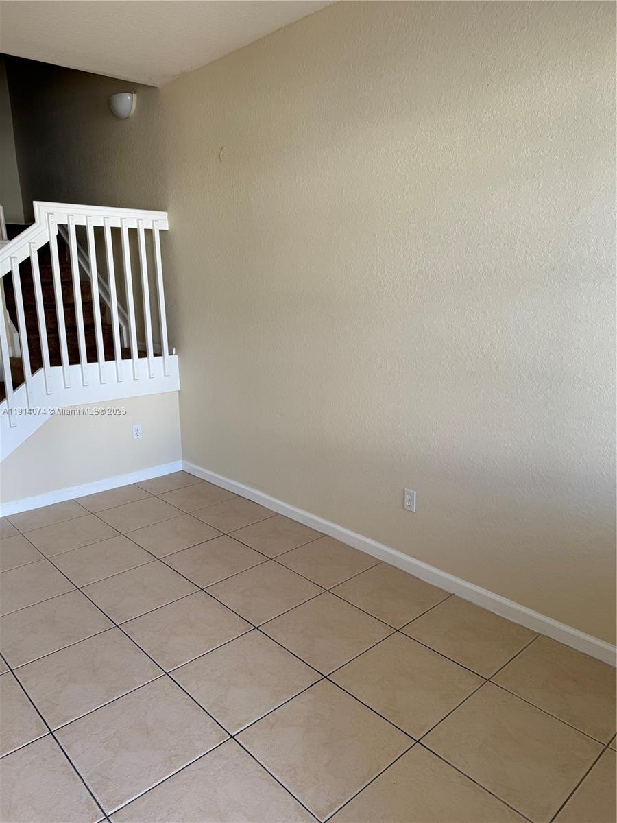 1713 Southwest Umbria Street, Unit 1713 Port St. Lucie, FL 34953 - Photo 3 of 17 a view of wooden floor