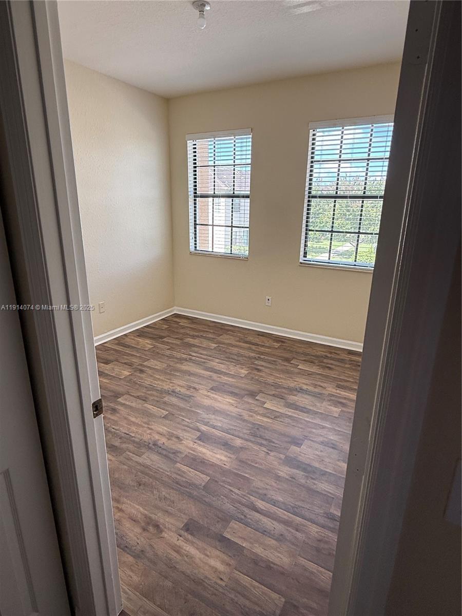 1713 Southwest Umbria Street, Unit 1713 Port St. Lucie, FL 34953 - Photo 10 of 17 an empty room with windows