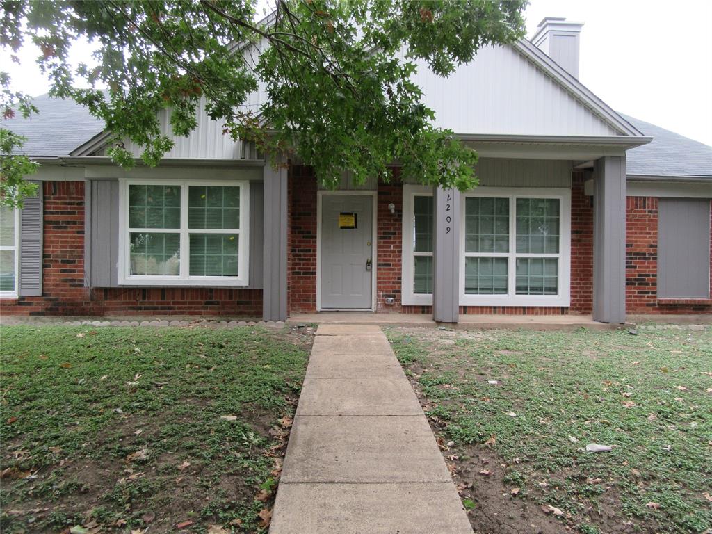 front view of a house with a yard