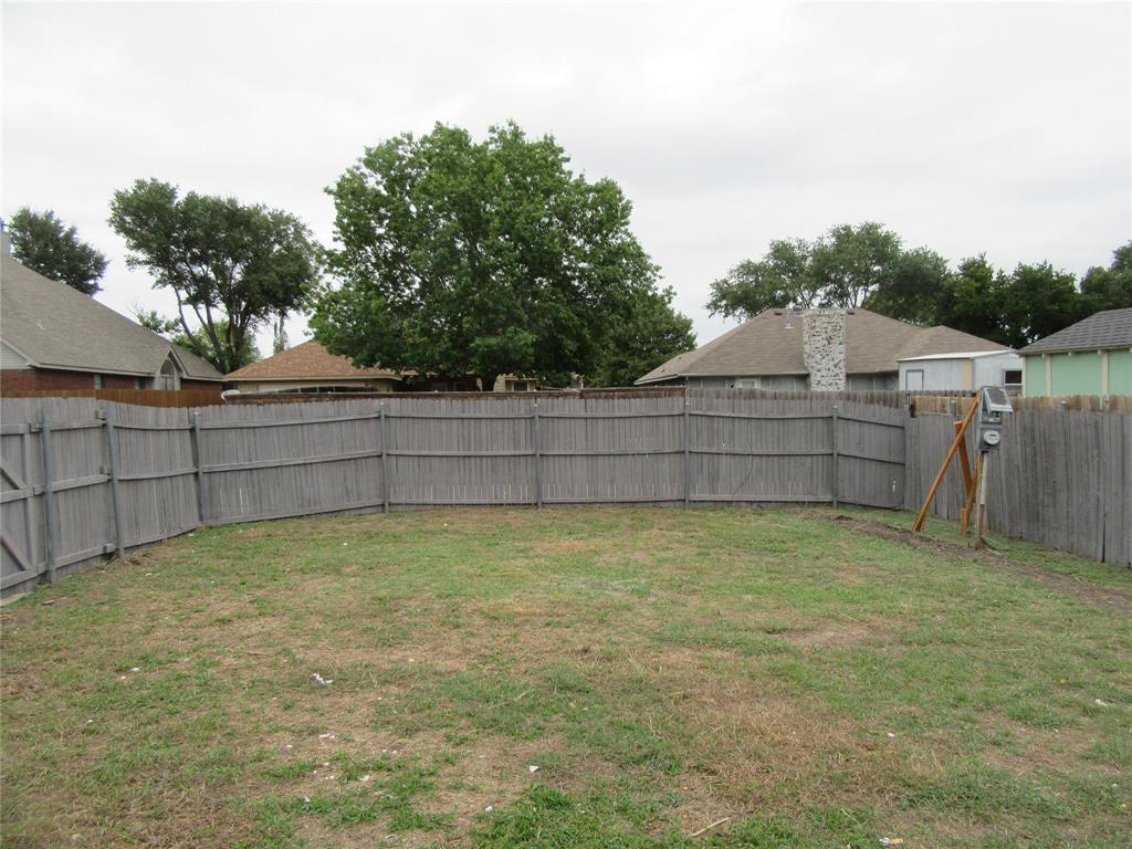 2209 Merrimac Lane Lancaster, TX 75146 - Photo 11 of 11 a view of a backyard