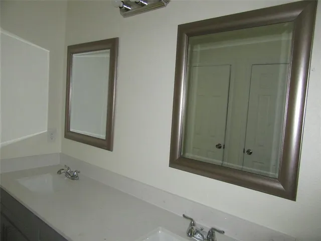 a bathroom with a bathtub and a sink