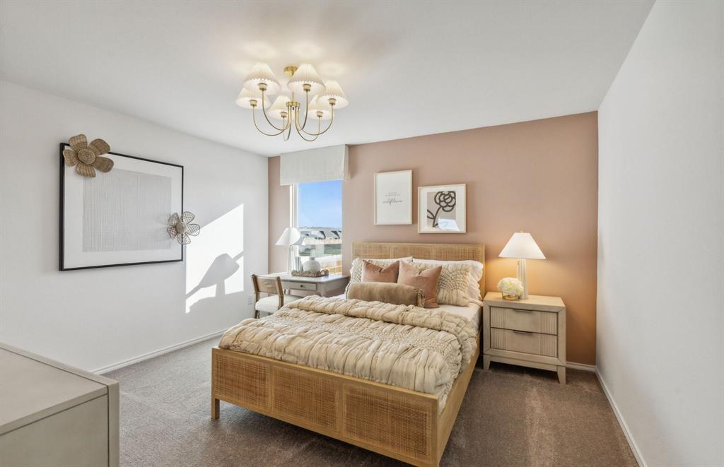 7505 Bent Gale Road Pilot Point, TX 76258 - Photo 15 of 20 a bedroom with a bed and a chandelier