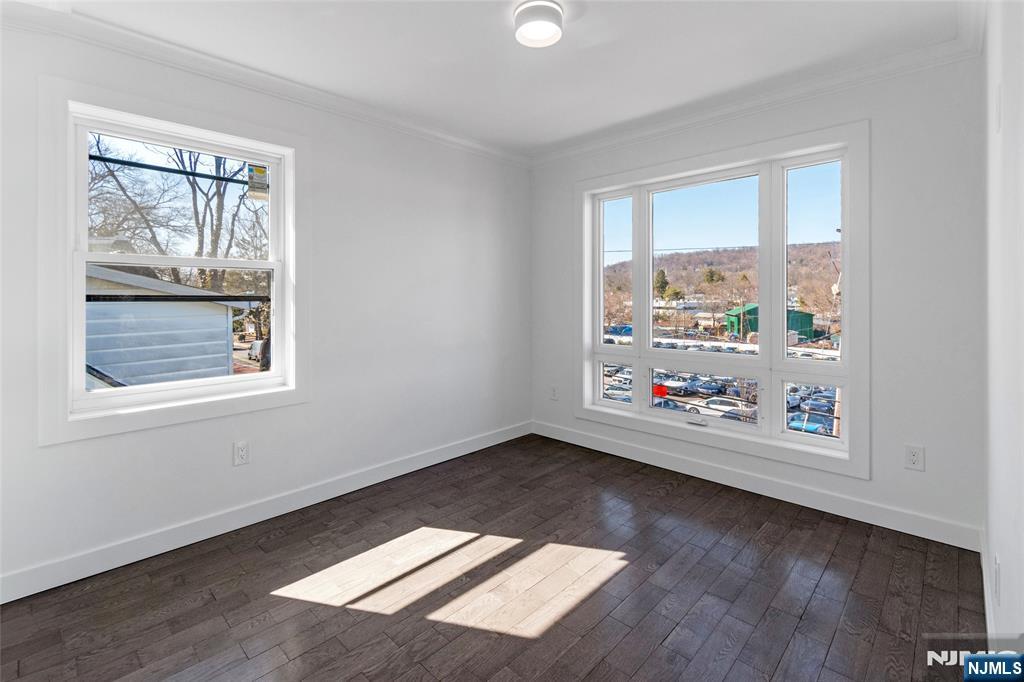 784 Valley Street Union, NJ 07088 - Photo 13 of 20 an empty room with wooden floor and windows