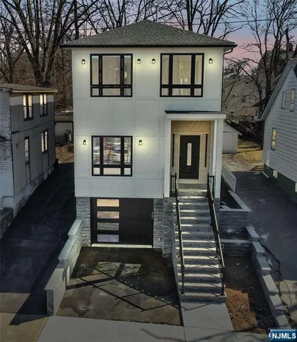 a front view of a house with stairs