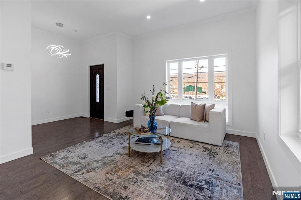 784 Valley Street Union, NJ 07088 - Photo 5 of 20 a living room with furniture and a potted plant