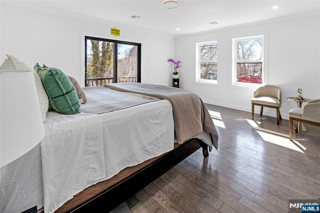 784 Valley Street Union, NJ 07088 - Photo 10 of 20 a bed sitting in a bedroom next to a window