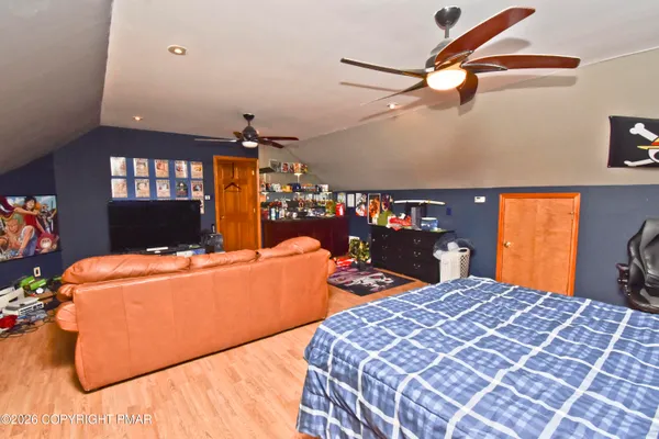 a bedroom with bed and window