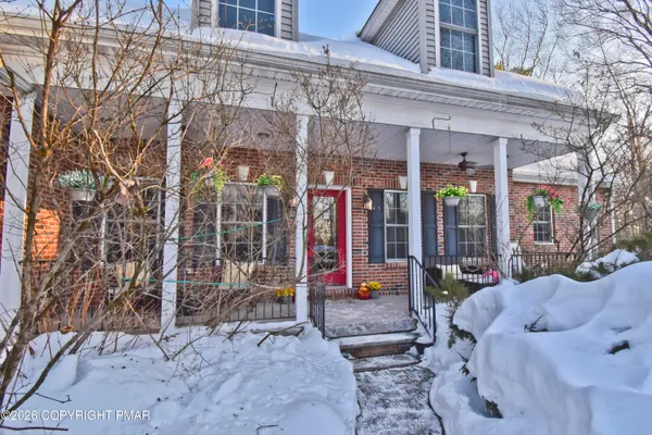 a view of a house with a snow in the yard