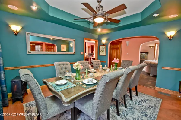 a view of a dining room with furniture and wooden floor
