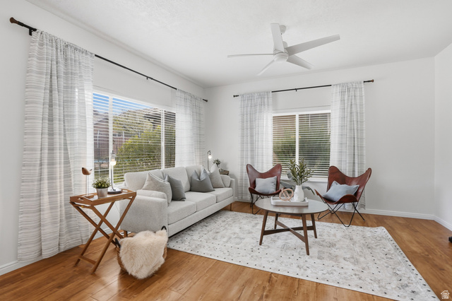2007 Fielding Hill Lane Draper, UT 84020 - Photo 5 of 83 Bright living space featuring abundant natural light, wood-finish flooring, a contemporary ceiling fan, white walls, and horizontal window blinds