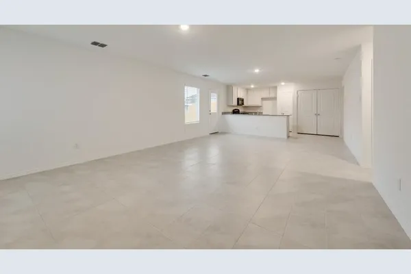 a view of a kitchen with a sink and cabinets