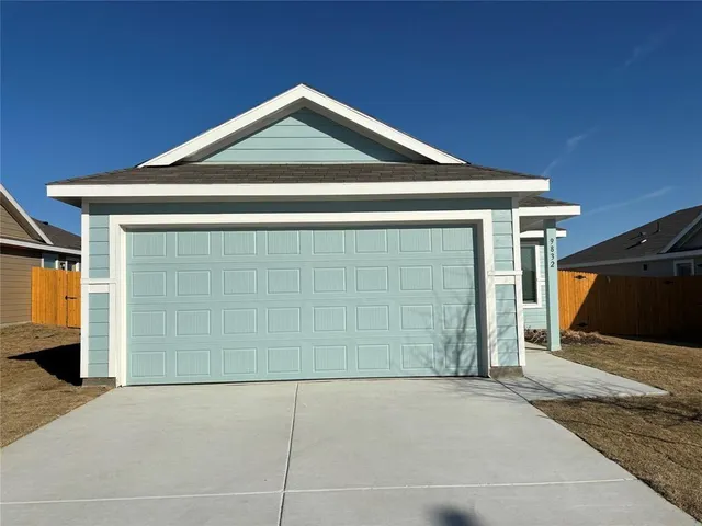 a front view of a house with a garage