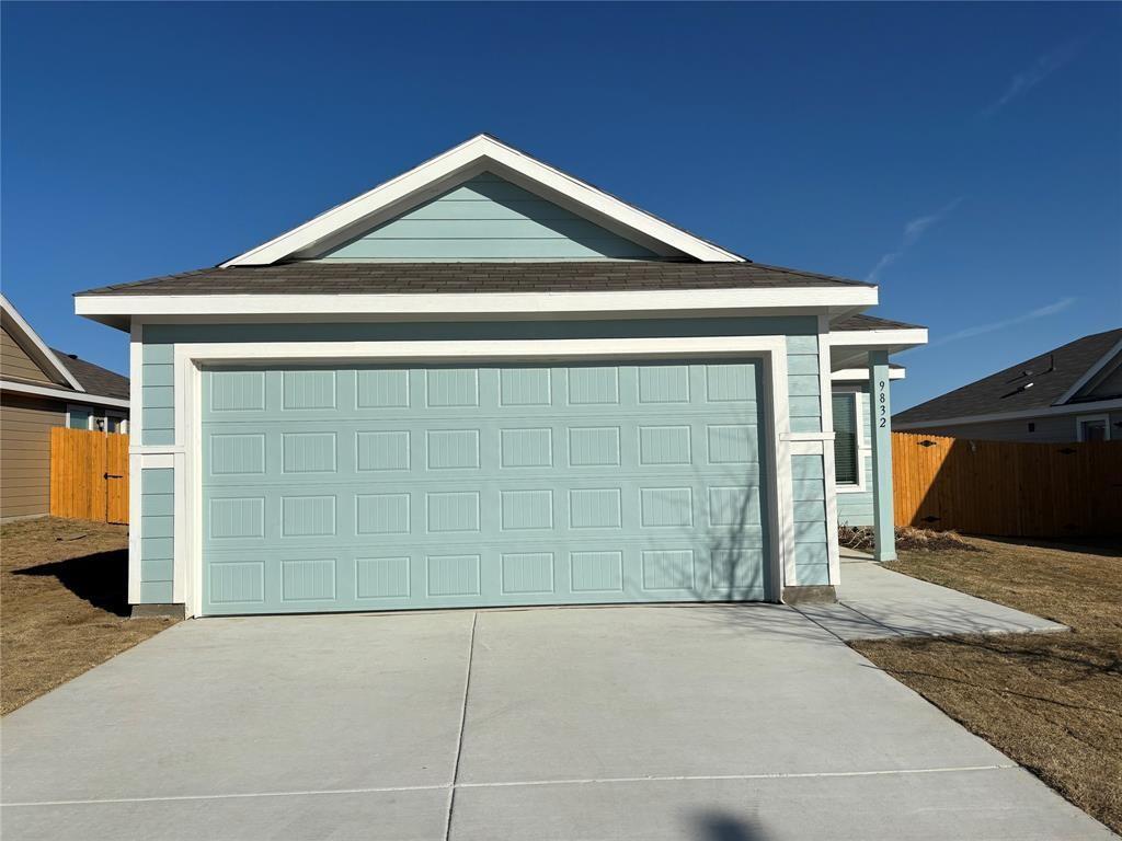 9832 Trusler Road Fort Worth, TX 76179 - Photo 2 of 13 a front view of a house with a garage