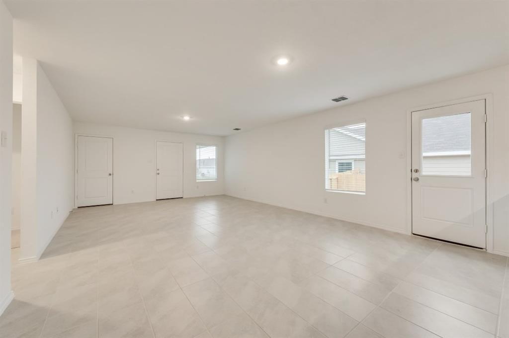 9832 Trusler Road Fort Worth, TX 76179 - Photo 3 of 13 an empty room with windows and closet