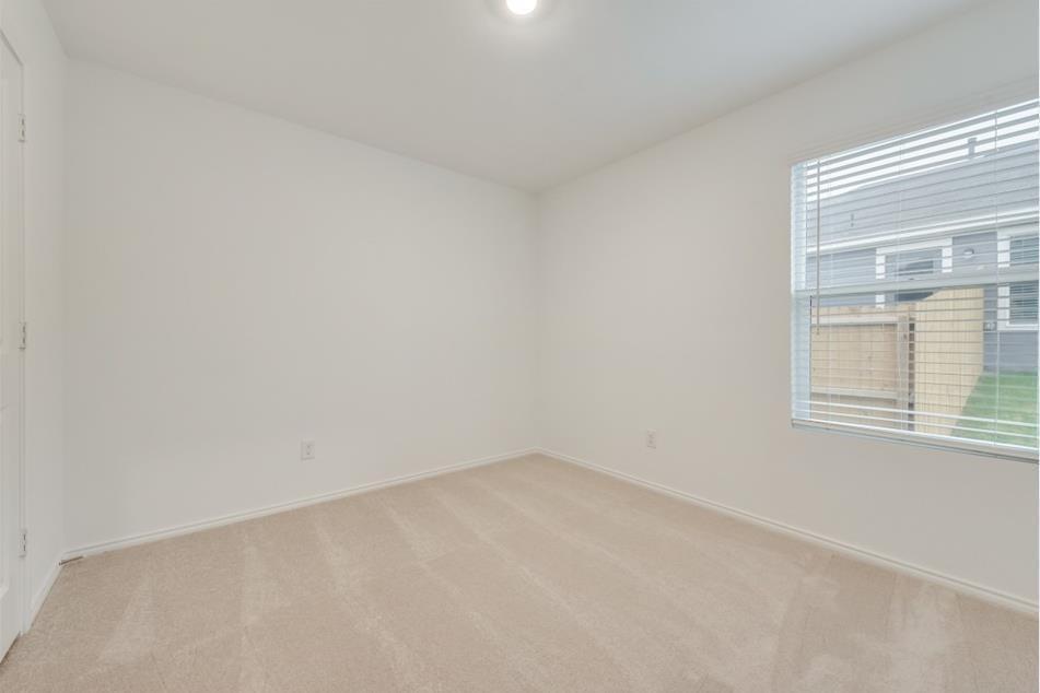 9832 Trusler Road Fort Worth, TX 76179 - Photo 8 of 13 an empty room with a window