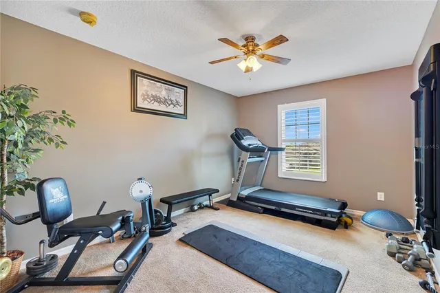 a room with gym equipment and a large window