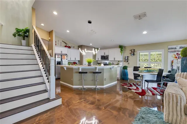 a living room with lots of furniture and white walls