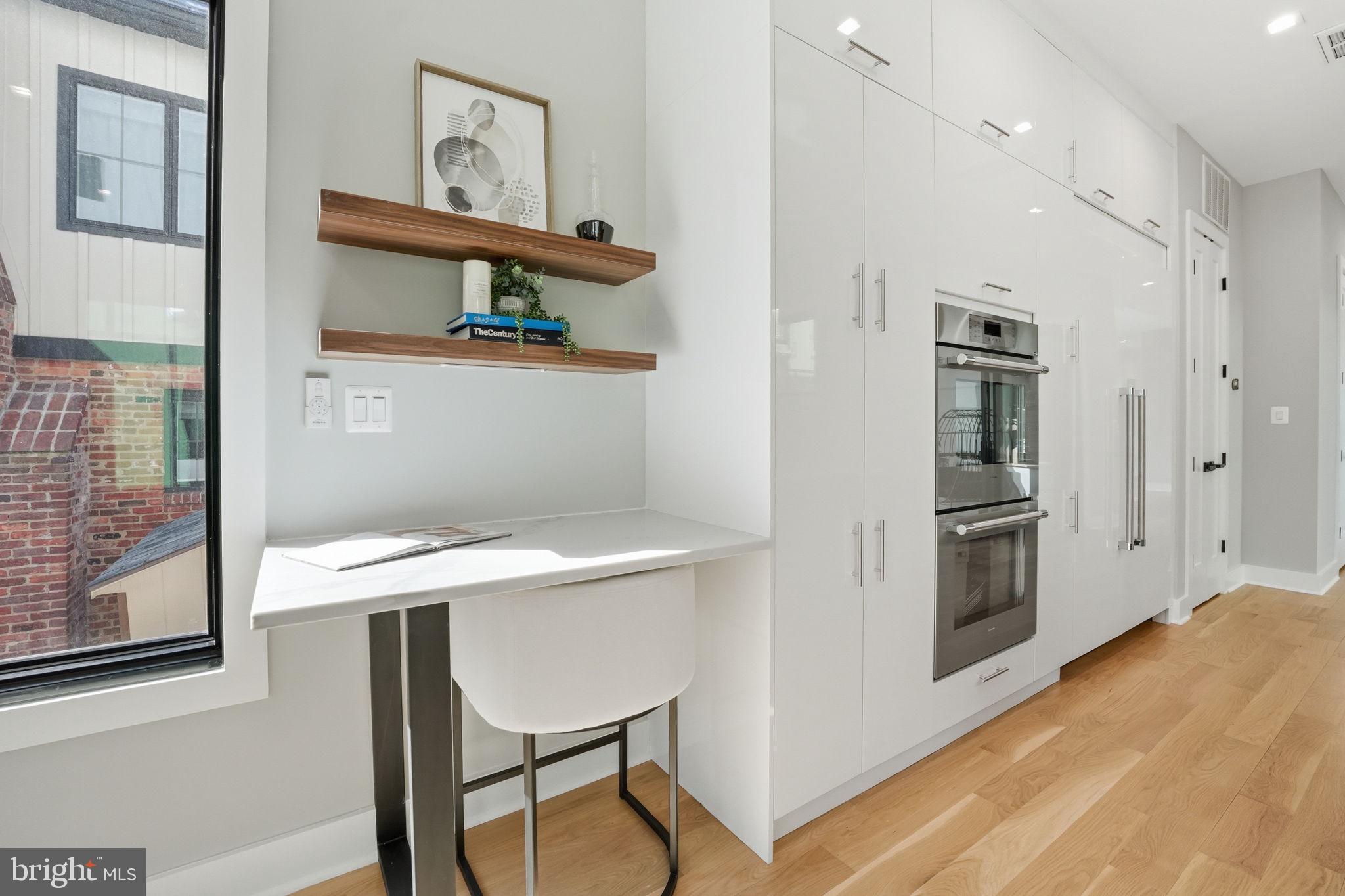 2211 Military Road Arlington, VA 22207 - Photo 22 of 107 Sleek kitchen with modern workspace.