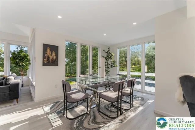 a view of a dining room with furniture window and outside view