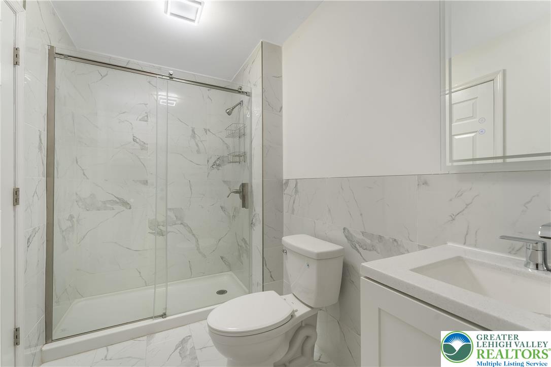 1855 Ridge Road Bangor, PA 18013 - Photo 17 of 53 a bathroom with a sink toilet and shower