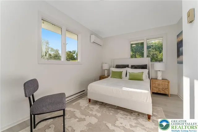 a bedroom with a bed and a chair