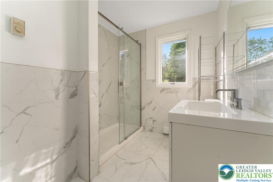 1855 Ridge Road Bangor, PA 18013 - Photo 29 of 53 a bathroom with a sink a toilet and shower