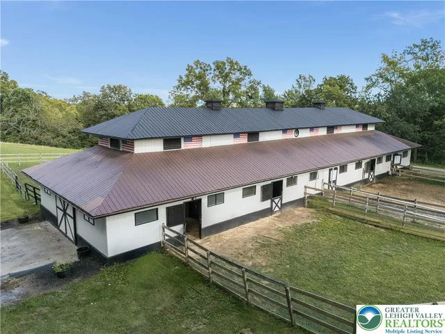 a aerial view of a house with a yard