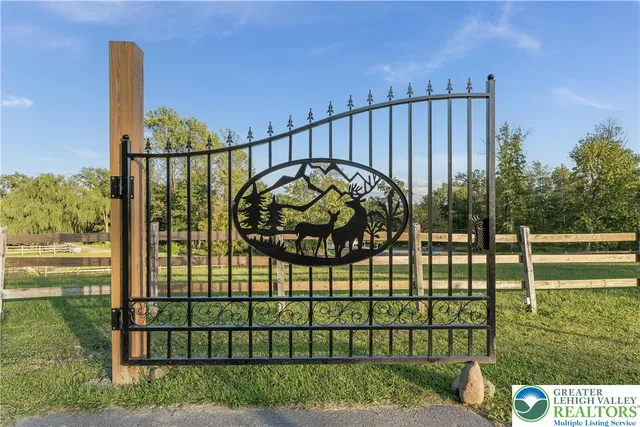 a view of a garden with a wooden fence