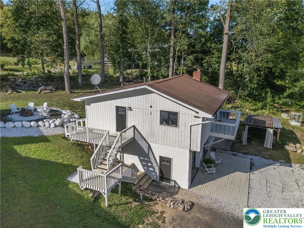 1855 Ridge Road Bangor, PA 18013 - Photo 8 of 53 a view of a white house with a yard and sitting area