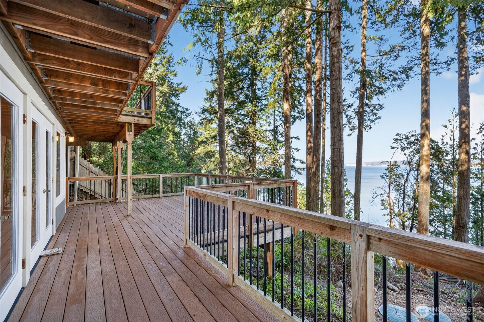 510 Carl Johnson Road Quilcene, WA 98376 - Photo 1 of 37 a view of backyard with a deck and wooden floor