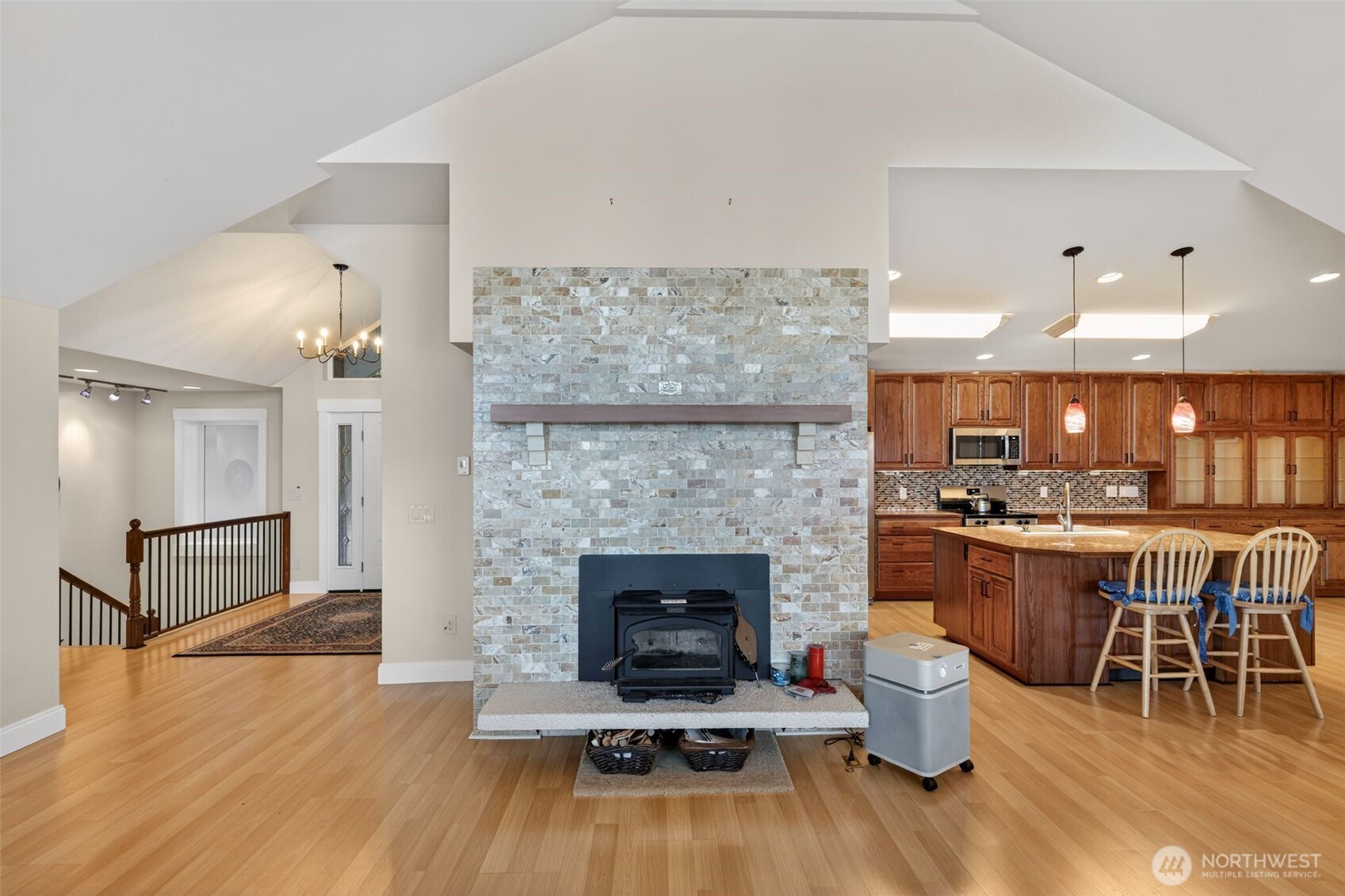 510 Carl Johnson Road Quilcene, WA 98376 - Photo 13 of 37 a living room with furniture a fireplace and kitchen view
