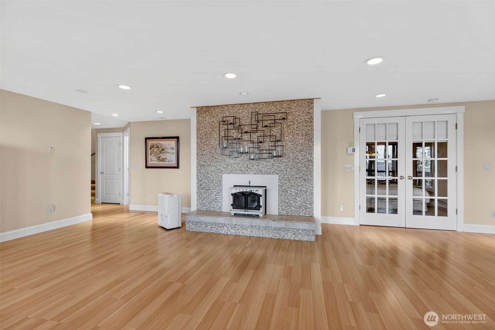 510 Carl Johnson Road Quilcene, WA 98376 - Photo 20 of 37 a view of a livingroom with wooden floor and a fireplace