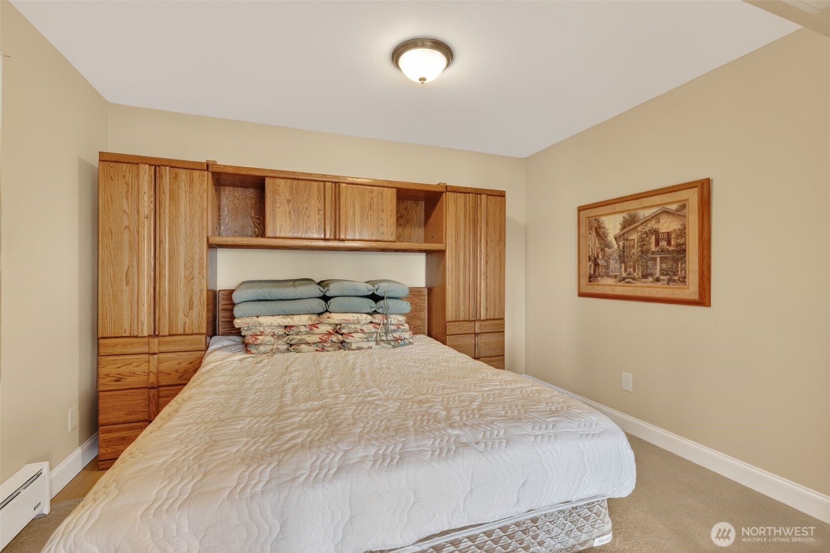 510 Carl Johnson Road Quilcene, WA 98376 - Photo 22 of 37 a bedroom with a bed and painting on the wall