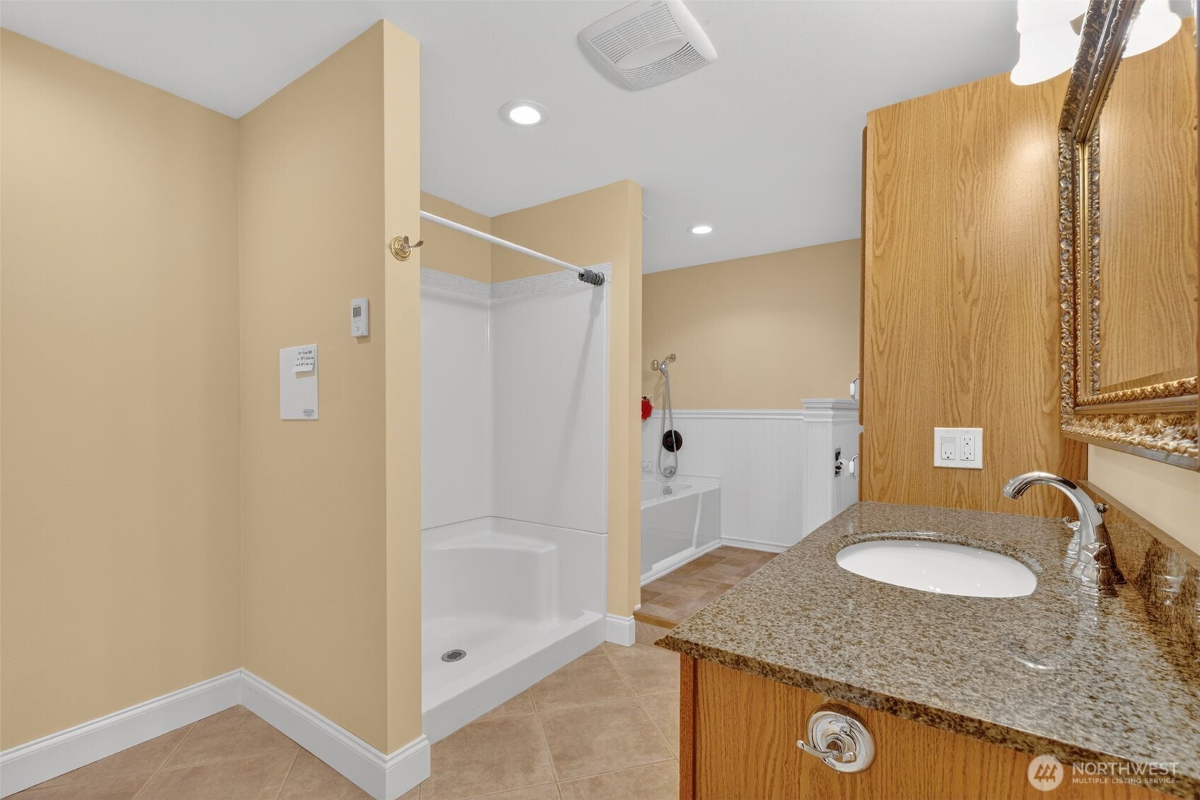 510 Carl Johnson Road Quilcene, WA 98376 - Photo 24 of 37 a bathroom with a granite countertop sink mirror and shower