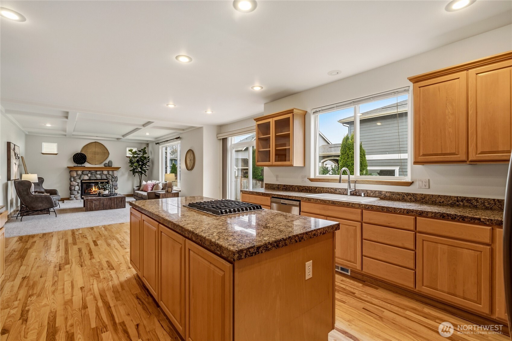 18639 175th Avenue Southeast Renton, WA 98058 - Photo 13 of 37 a kitchen with stainless steel appliances granite countertop sink stove top oven and cabinets