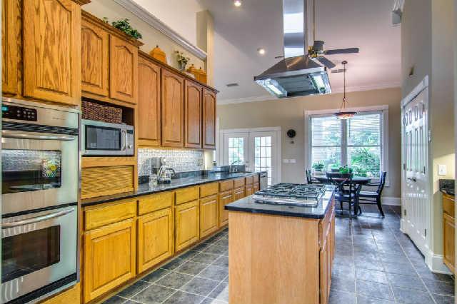 4235 Fairview Road Columbia, TN 38401 - Photo 11 of 20 Kitchen boast stainless appliances, double oven, island cooktop, granite countertops and tile floor.