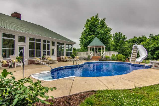 4235 Fairview Road Columbia, TN 38401 - Photo 19 of 20 You can stay refreshed all summer swimming in this sparkling, heated inground pool with slide and waterfall.