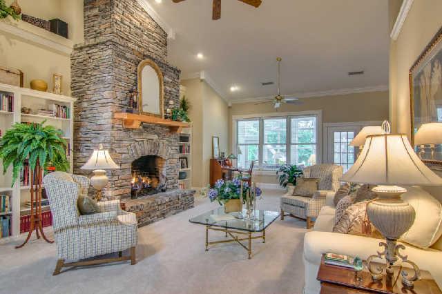 4235 Fairview Road Columbia, TN 38401 - Photo 6 of 20 Charming front to back living room features a majestic floor to ceiling rock fireplace.