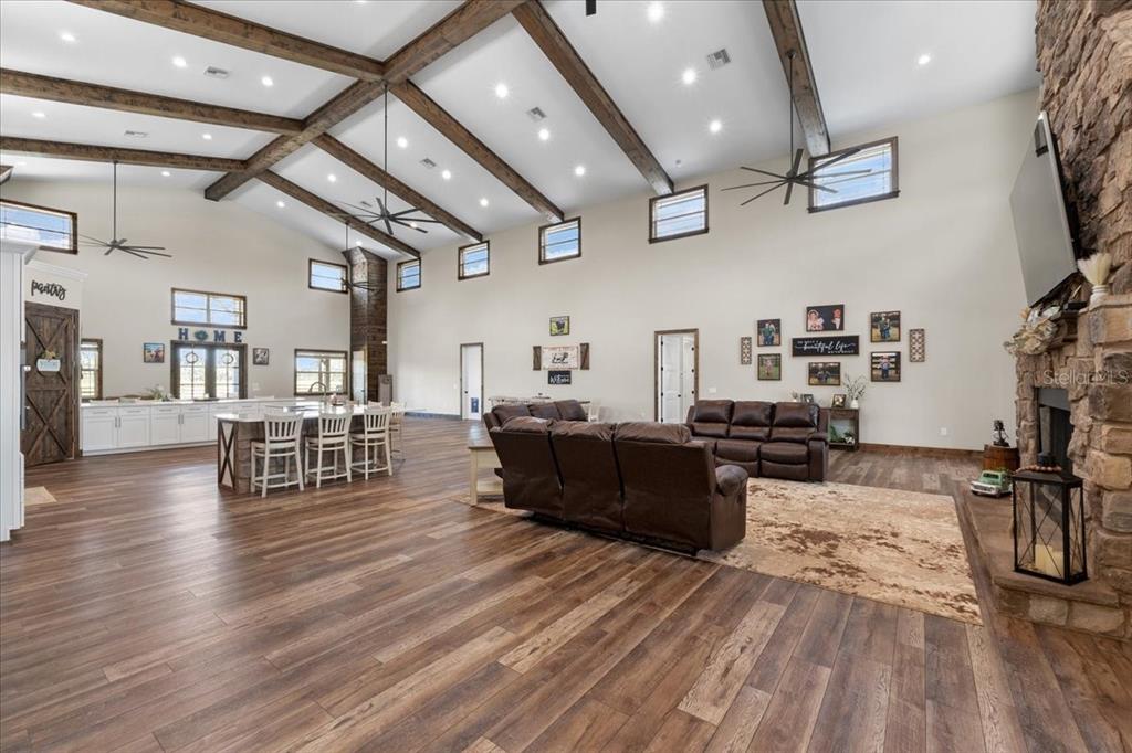 11657 Moore Road Lakeland, FL 33809 - Photo 13 of 100 a living room with lots of furniture and wooden floors