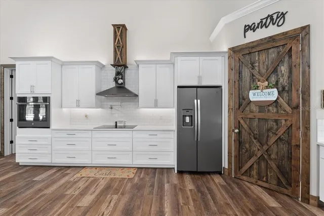 a bathroom with double vanity sinks and a mirror