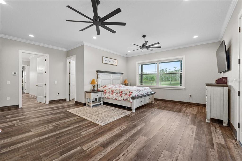 11657 Moore Road Lakeland, FL 33809 - Photo 18 of 100 a bedroom with furniture and a window