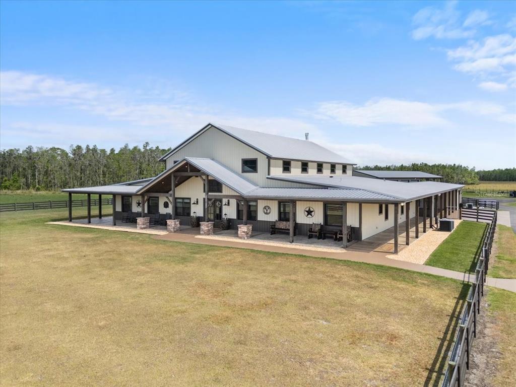 11657 Moore Road Lakeland, FL 33809 - Photo 2 of 100 front view of a house with a swimming pool