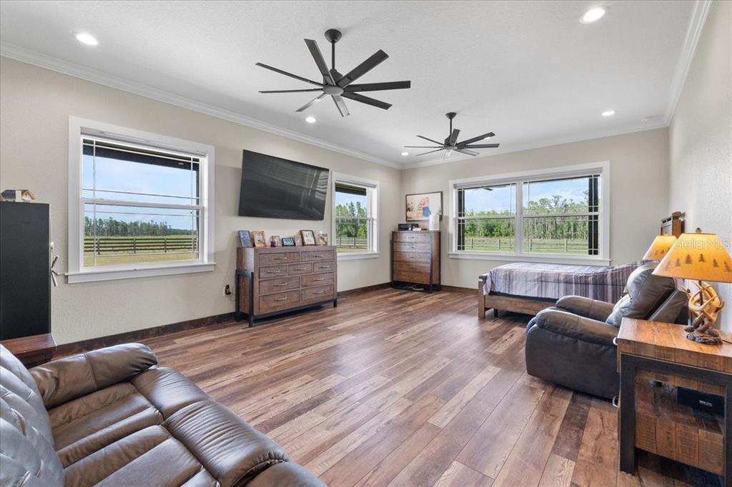 11657 Moore Road Lakeland, FL 33809 - Photo 25 of 100 a living room with furniture and a flat screen tv