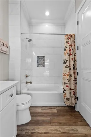 a bathroom with a double vanity sink a mirror and a shower