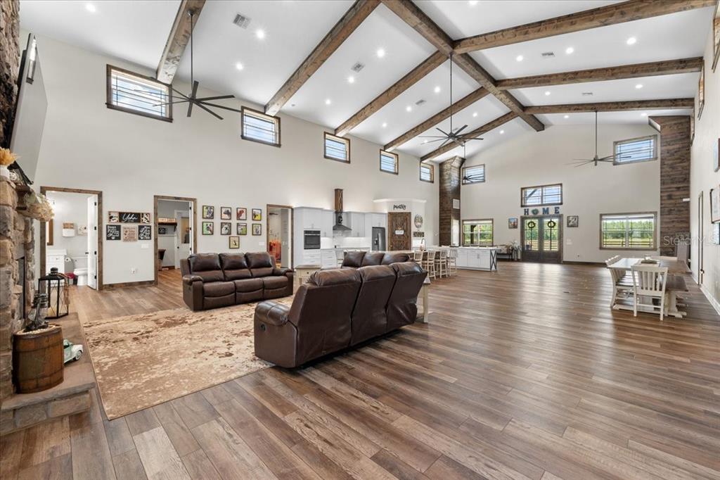 11657 Moore Road Lakeland, FL 33809 - Photo 8 of 100 a living room with lots of furniture and kitchen view