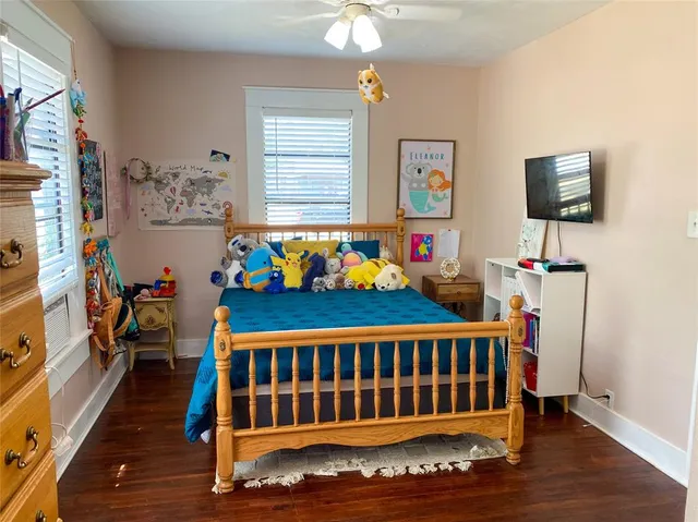 a bedroom with furniture and a window